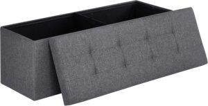 SONGMICS storage ottoman bench used as end-of-bed seating and foot rest in bedroom setting