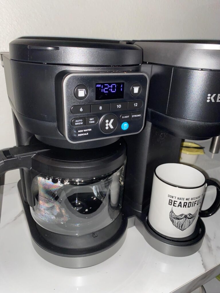 Keurig K-Duo coffee maker review showing both single cup and carafe brewing in modern kitchen setting