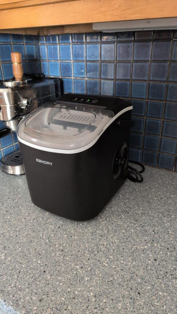 EUHOMY countertop ice maker in action producing bullet ice